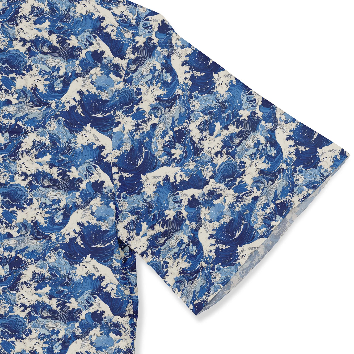 Blue wave pattern fabric, folded corner, white background.