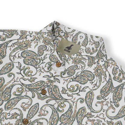 A short-sleeved shirt with a &quot;Serenity Scrolls&quot; pattern, featuring blue and white paisley motifs and floral vines framed by geometric borders front view