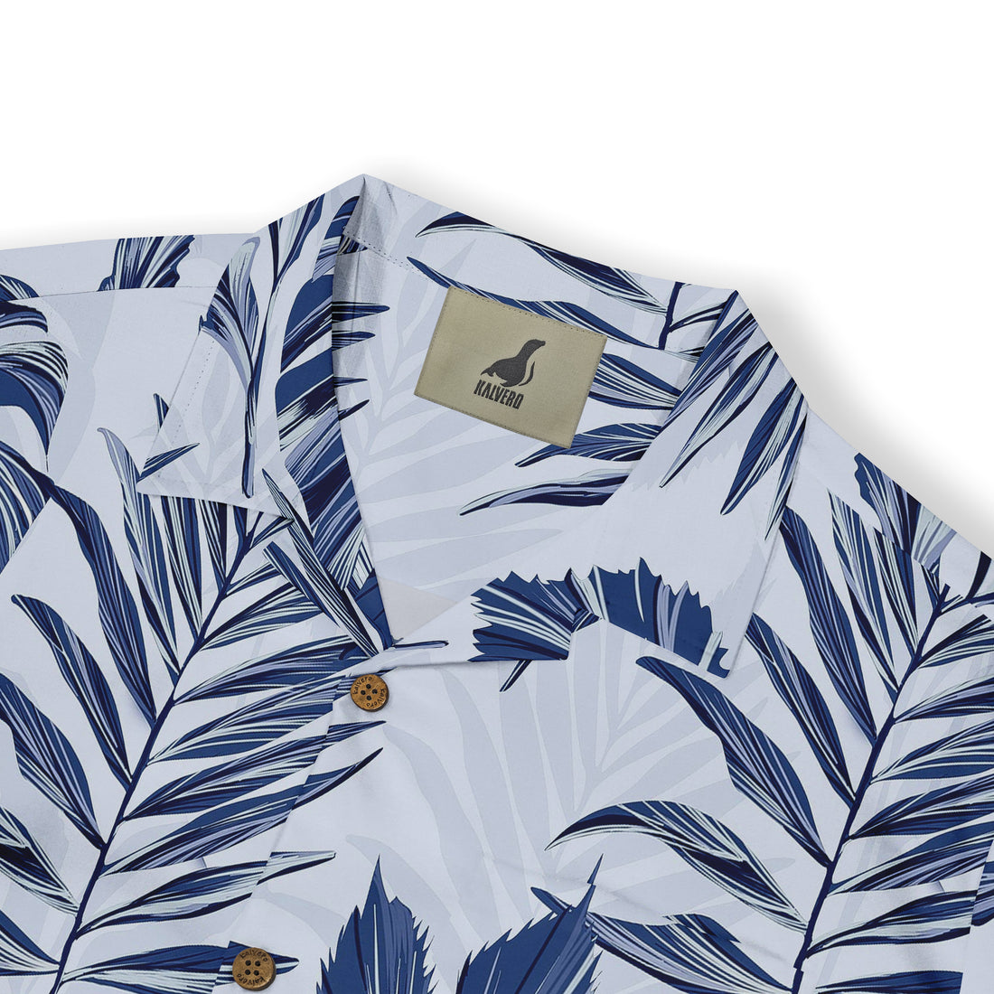 Blue and white tropical leaf pattern shirt with wooden buttons.