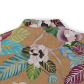 A detailed view of the shirt’s back collar area, featuring a vibrant floral and leaf pattern in soft greens, blues, purples, and beige tones, giving a natural and artistic look to the design.​