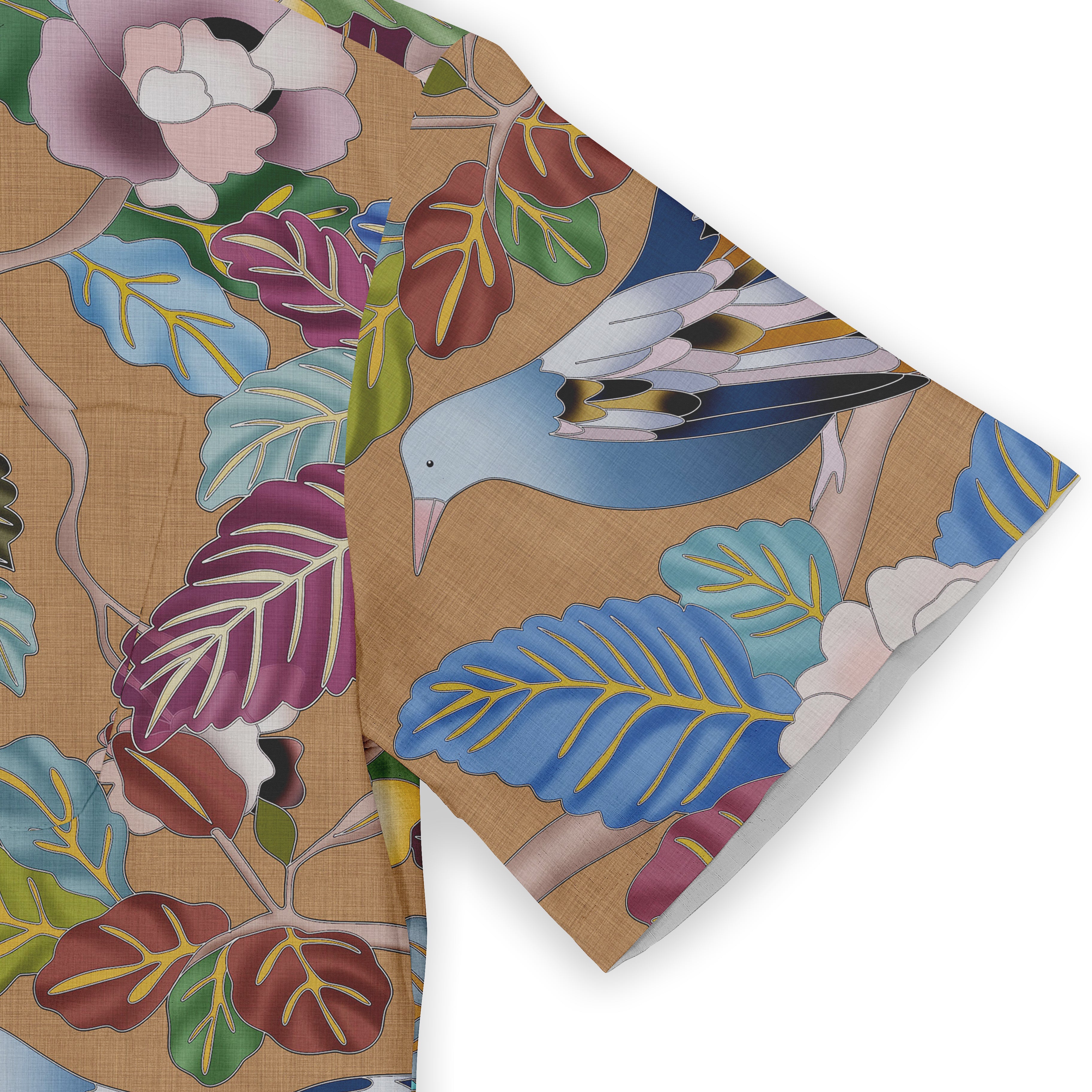 A shirt sleeve featuring a colorful bird and vibrant leaves against a beige background, highlighting nature&