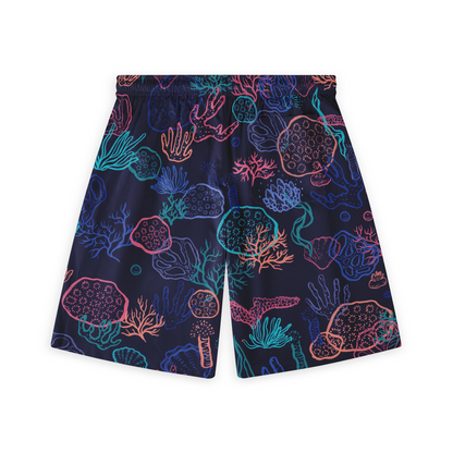 Back view of shorts with a vibrant coral reef pattern in neon colors on a dark background.