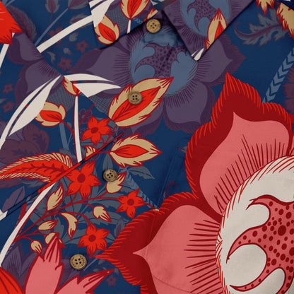 Close-up of a Hawaiian shirt with a bold floral pattern in red, purple, and blue tones, featuring detailed flowers and brown buttons.