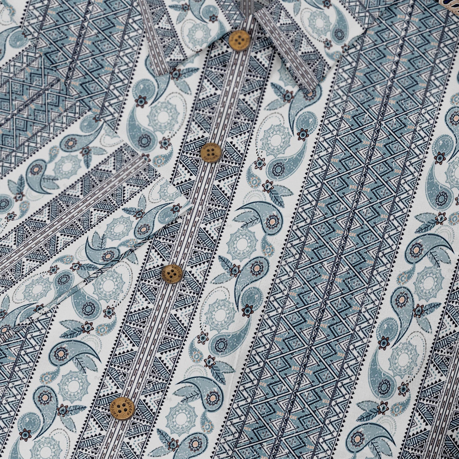 Blue and white patterned fabric with paisley and geometric designs.