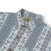 Blue and white patterned shirt with buttons and logo tag.