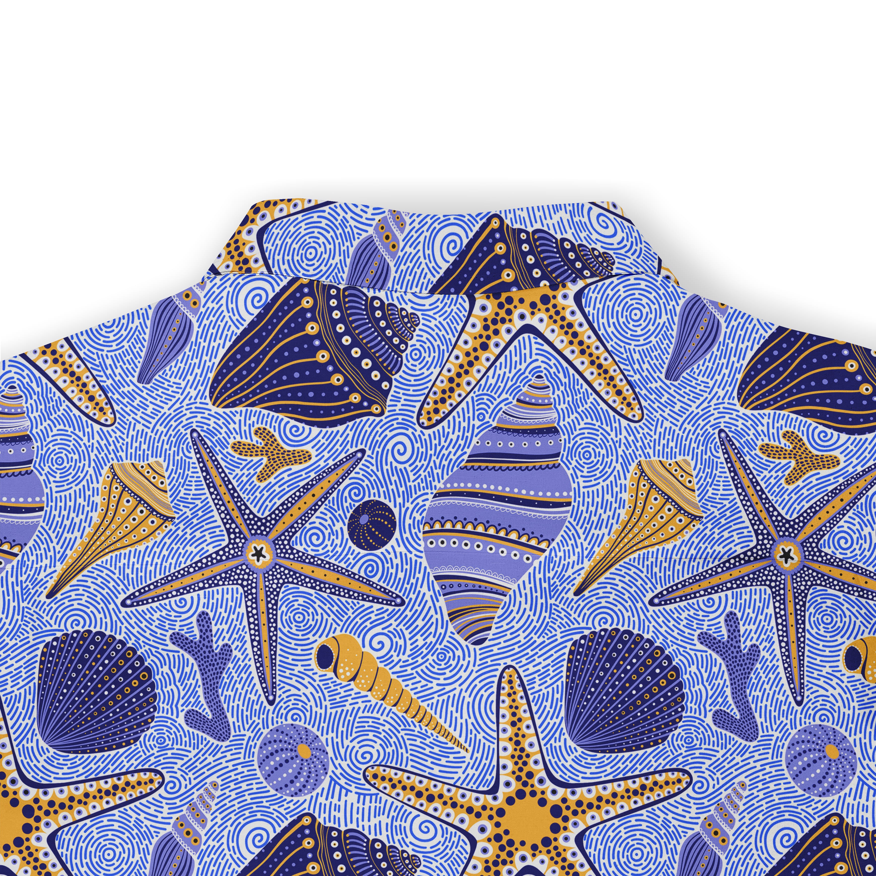 Close-up of a blue Hawaiian shirt featuring gold and blue seashells, starfish, and other marine elements.