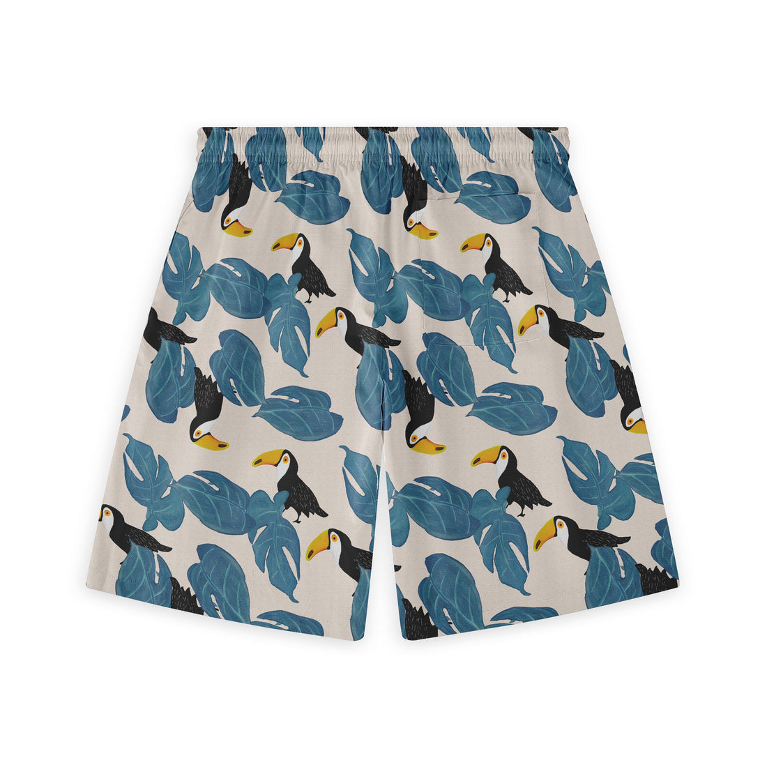 Shorts with a light beige background featuring blue leaves and toucans, embodying a tropical vibe.