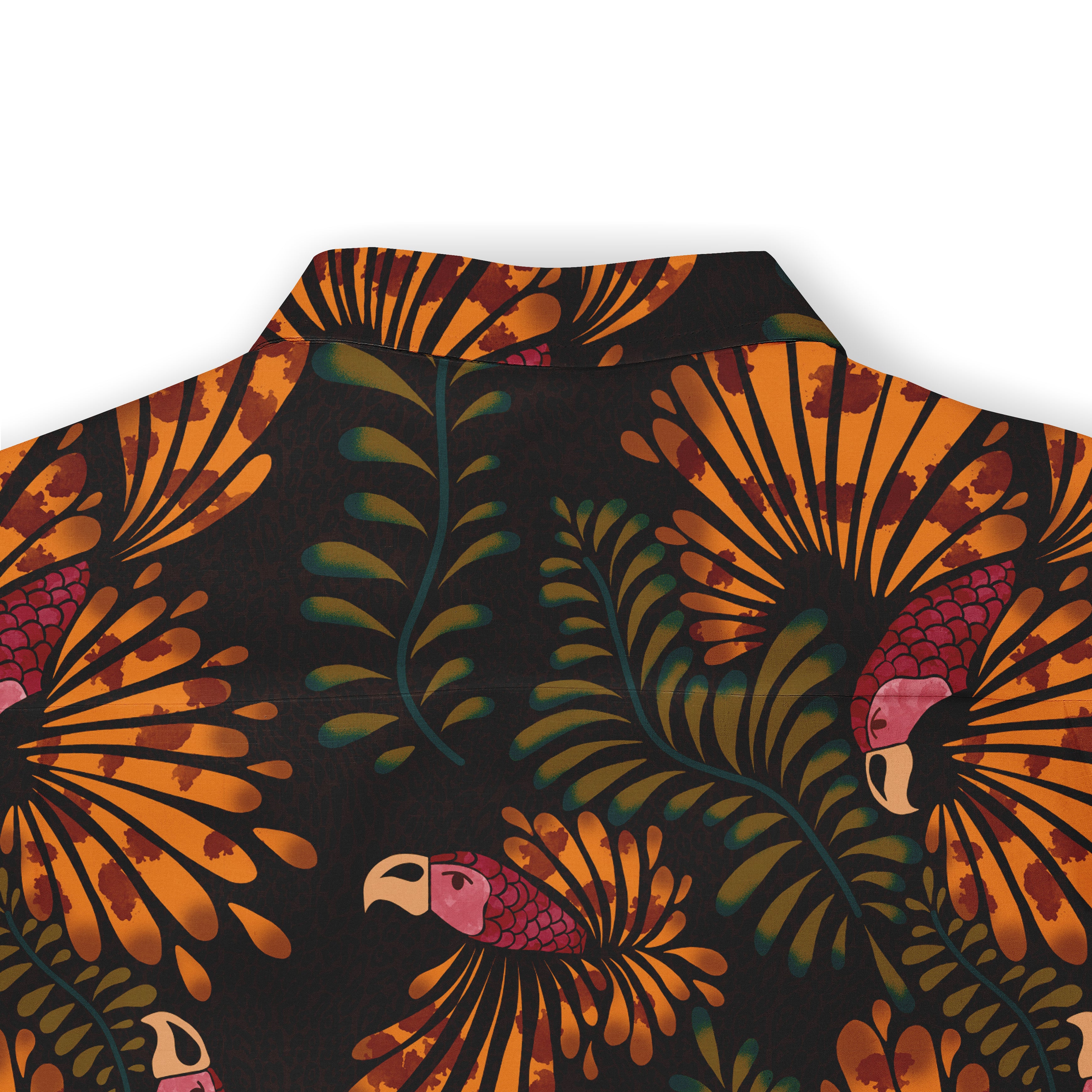 Close-up of the back of a shirt featuring a vibrant design of orange tropical foliage and pink parrots on a dark background. The collar is visible, complementing the overall pattern.