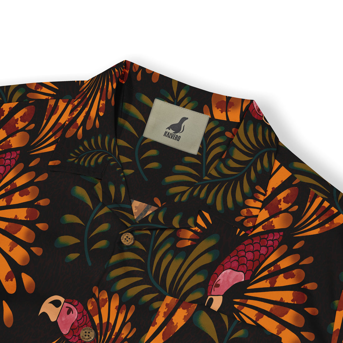 Close-up of a dark shirt collar featuring a vibrant tropical design with orange foliage and a parrot motif, showcasing intricate details and the Kalvero label.