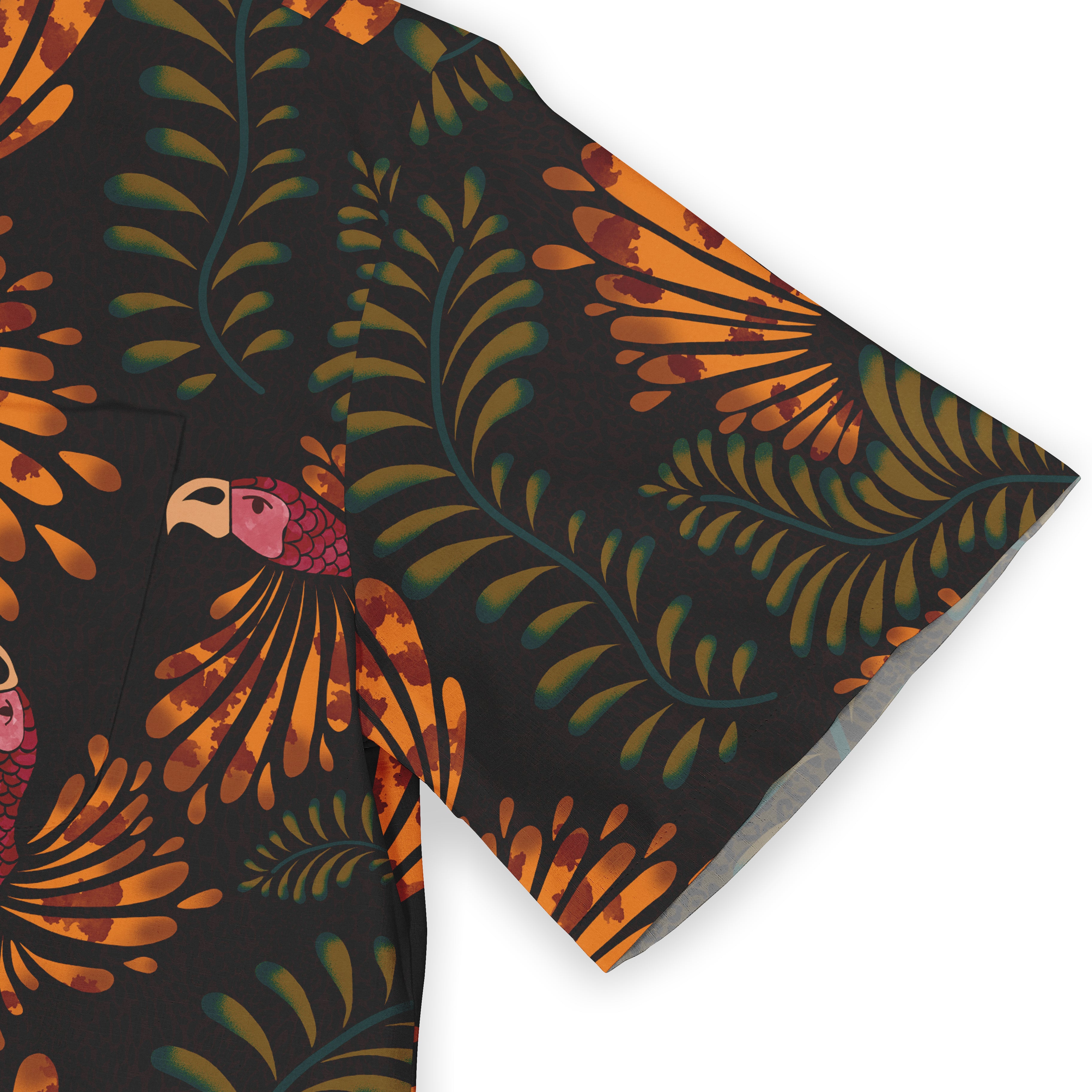 Close-up of a sleeve featuring a vibrant tropical design with lush green foliage and a bright orange parrot motif on a dark background.