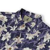Dark blue shirt with white lilies and purple leaves.