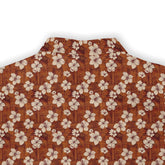 Copper shirt with white hibiscus flowers, exuding vintage elegance back view